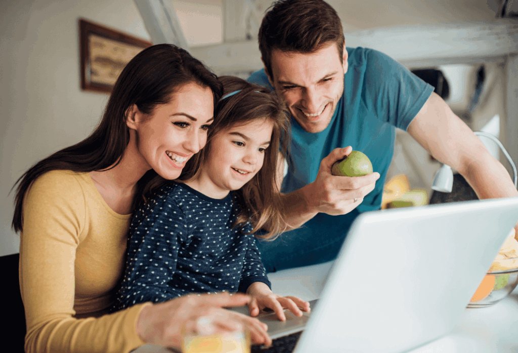 A family with a laptop.
